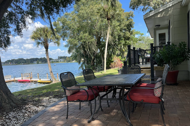 outdoor table and chairs backyard Lake view